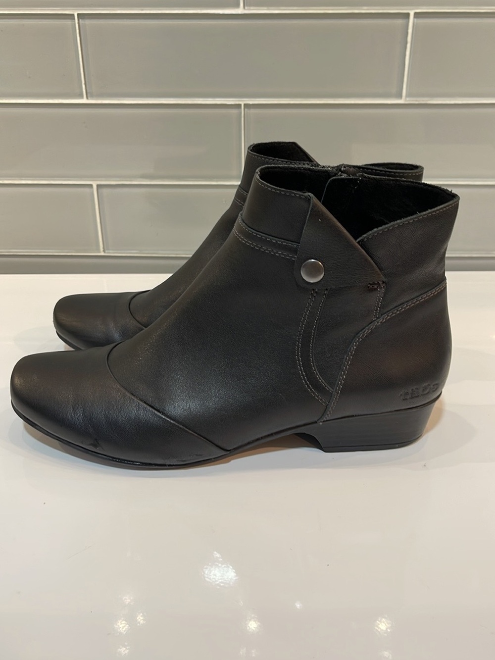 Taos Footwear Black Leather Ankle Booties with Snap Accent